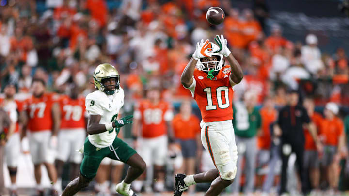 Sep 13, 2025; Miami Gardens, Florida, USA; Miami Hurricanes wide receiver Malachi Toney (10) catches a pass against the South Florida Bulls in the third quarter at Hard Rock Stadium. Mandatory Credit: Nathan Ray Seebeck-Imagn Images