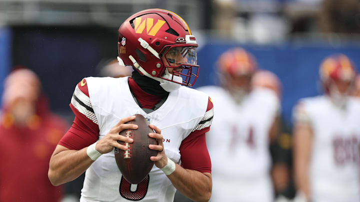 Dec 14, 2025; East Rutherford, New Jersey, USA;  Washington Commanders quarterback Marcus Mariota (8) looks to pass during the first quarter against the New York Giants at MetLife Stadium. Mandatory Credit: Vincent Carchietta-Imagn Images