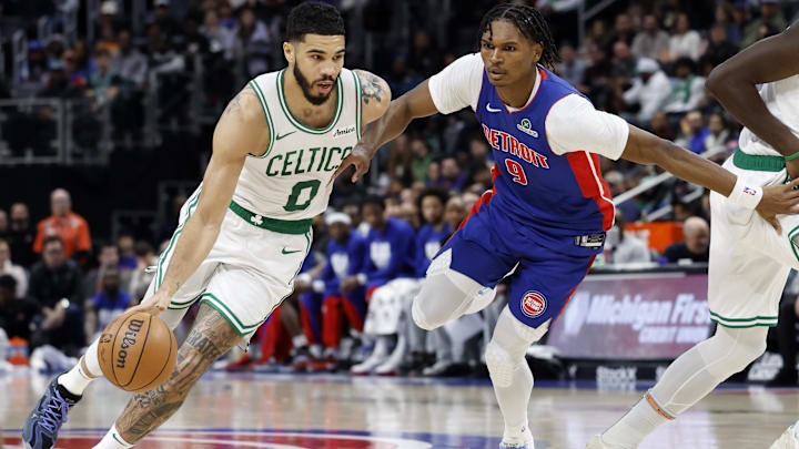 Feb 26, 2025; Detroit, Michigan, USA;  Boston Celtics forward Jayson Tatum (0) dribbles on Detroit Pistons forward Ausar Thompson (9) in the first half at Little Caesars Arena. Mandatory Credit: Rick Osentoski-Imagn Images
