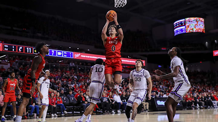 Mar 5, 2025; Cincinnati, Ohio, USA; Cincinnati Bearcats guard Dan Skillings Jr. (0) shoots against the Kansas State Wildcats in the first half at Fifth Third Arena. Mandatory Credit: Katie Stratman-Imagn Images Mar 5, 2025; Cincinnati, Ohio, USA; Cincinnati Bearcats guard Dan Skillings Jr. (0) shoots against the Kansas State Wildcats in the first half at Fifth Third Arena. Mandatory Credit: Katie Stratman-Imagn Images