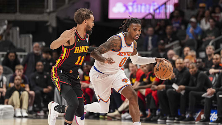 Apr 5, 2025; Atlanta, Georgia, USA; New York Knicks guard Delon Wright (0) dribbles past Atlanta Hawks guard Trae Young (11) during the first half at State Farm Arena. Mandatory Credit: Dale Zanine-Imagn Images Apr 5, 2025; Atlanta, Georgia, USA; New York Knicks guard Delon Wright (0) dribbles past Atlanta Hawks guard Trae Young (11) during the first half at State Farm Arena. Mandatory Credit: Dale Zanine-Imagn Images