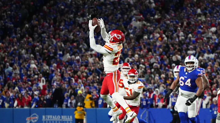 Nov 17, 2024; Orchard Park, New York, USA; Kansas City Chiefs safety Chamarri Conner (27) intercepts a pass against the Buffalo Bills during the first half at Highmark Stadium. Mandatory Credit: Gregory Fisher-Imagn Images