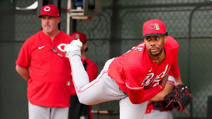 Cincinnati Reds pitcher Hunter Greene (21) throws a bullpen session with pitching coach/director of pitching Derek Johnson (36) at the Cincinnati Reds player development complex in Goodyear, Ariz., on Friday, Feb. 13, 2026.