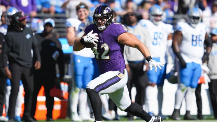 Oct 22, 2023; Baltimore, Maryland, USA; Baltimore Ravens running back Patrick Ricard (42) runs the ball against the Detroit Lions during the second quarter at M&T Bank Stadium. Mandatory Credit: Mitch Stringer-USA TODAY Sports