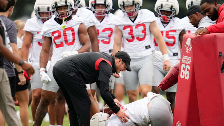 Ohio State Buckeyes safeties coach Matt Guerrieri works with linebacker Payton Pierce (26) on ball protection during the first football practice of the season at the Woody Hayes Athletic Center on July 31, 2025.