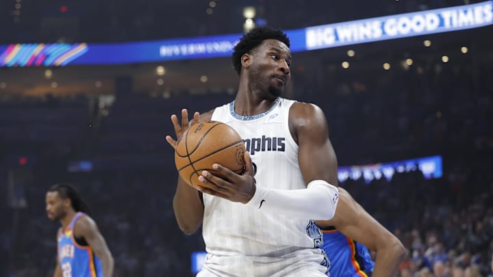Dec 22, 2025; Oklahoma City, Oklahoma, USA; Memphis Grizzlies forward Jaren Jackson Jr. (8) moves the ball around Oklahoma City Thunder guard Jalen Williams (8) during the first quarter at Paycom Center. Mandatory Credit: Alonzo Adams-Imagn Images
