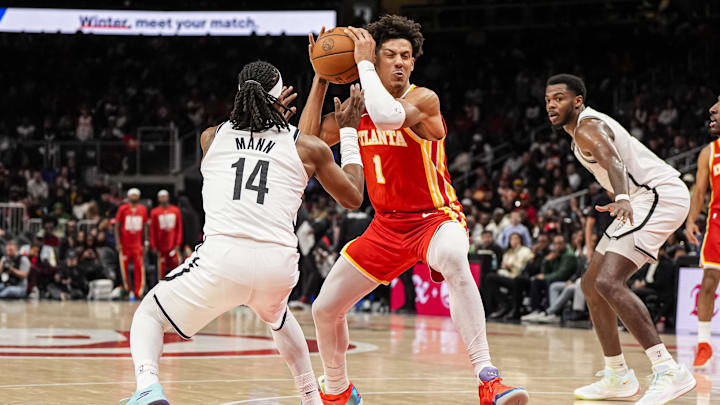 Feb 22, 2026; Atlanta, Georgia, USA; Atlanta Hawks forward Jalen Johnson (1) tries to get to the basket against Brooklyn Nets guard Terance Mann (14) during the second half at State Farm Arena. Mandatory Credit: Dale Zanine-Imagn Images Feb 22, 2026; Atlanta, Georgia, USA; Atlanta Hawks forward Jalen Johnson (1) tries to get to the basket against Brooklyn Nets guard Terance Mann (14) during the second half at State Farm Arena. Mandatory Credit: Dale Zanine-Imagn Images