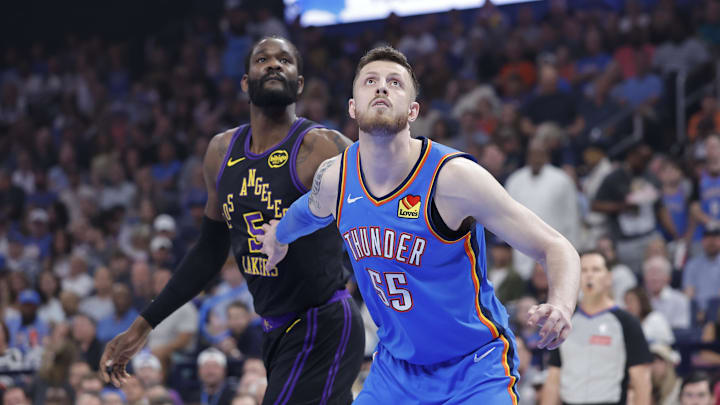 Apr 2, 2026; Oklahoma City, Oklahoma, USA; Oklahoma City Thunder center Isaiah Hartenstein (55) and Los Angeles Lakers center Deandre Ayton (5) look up for a rebound during the first quarter at Paycom Center. Mandatory Credit: Alonzo Adams-Imagn Images