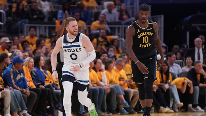 May 12, 2025; San Francisco, California, USA; Minnesota Timberwolves guard Donte DiVincenzo (0) reacts next to Golden State Warriors forward Jimmy Butler III (10) after making a three point basket in the third quarter during game four of the second round for the 2025 NBA Playoffs at Chase Center. Mandatory Credit: Cary Edmondson-Imagn Images May 12, 2025; San Francisco, California, USA; Minnesota Timberwolves guard Donte DiVincenzo (0) reacts next to Golden State Warriors forward Jimmy Butler III (10) after making a three point basket in the third quarter during game four of the second round for the 2025 NBA Playoffs at Chase Center. Mandatory Credit: Cary Edmondson-Imagn Images