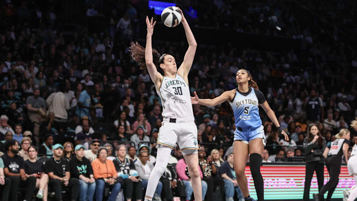 Jun 10, 2025; Brooklyn, New York, USA;  New York Liberty forward Breanna Stewart (30) jumps past Chicago Sky forward Angel Reese (5) to grab a rebound in the first quarter at Barclays Center. Mandatory Credit: Wendell Cruz-Imagn Images