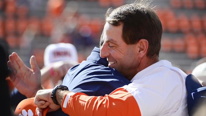 Oct 19, 2024; Clemson, South Carolina, USA; Clemson Tigers head coach Dabo Swinney greets Virginia Cavaliers Head Coach Tony Elliott prior to the game at Memorial Stadium. Mandatory Credit: Alexander Hicks-Imagn Images