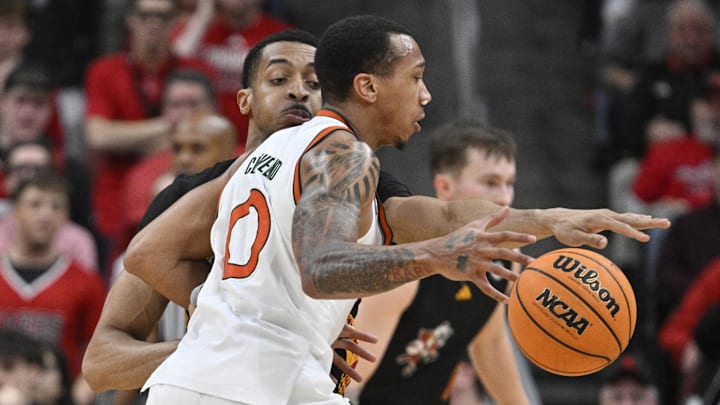 Feb 8, 2025; Louisville, Kentucky, USA; Louisville Cardinals center Frank Anselem-Ibe (13) pressures the dribble of Miami (Fl) Hurricanes guard Matthew Cleveland (0) during the second half at KFC Yum! Center. Louisville defeated Miami 88-78. Mandatory Credit: Jamie Rhodes-Imagn Images Feb 8, 2025; Louisville, Kentucky, USA; Louisville Cardinals center Frank Anselem-Ibe (13) pressures the dribble of Miami (Fl) Hurricanes guard Matthew Cleveland (0) during the second half at KFC Yum! Center. Louisville defeated Miami 88-78. Mandatory Credit: Jamie Rhodes-Imagn Images