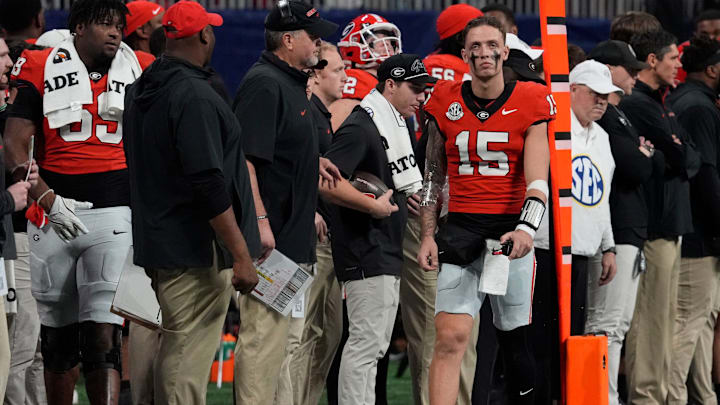 Georgia quarterback Carson Beck (15) on the sideline after leaving the game during the second half of the SEC championship game against Texas in Atlanta, on Saturday, Dec. 7, 2024.
