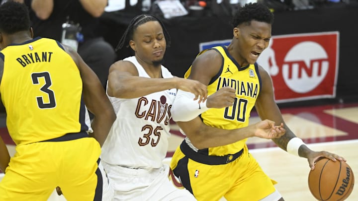 May 6, 2025; Cleveland, Ohio, USA; Indiana Pacers guard Bennedict Mathurin (00) dribbles around center Thomas Bryant (3) and Cleveland Cavaliers forward Isaac Okoro (35) in the third quarter during game two of the second round of the 2025 NBA Playoffs at Rocket Arena. Mandatory Credit: David Richard-Imagn Images May 6, 2025; Cleveland, Ohio, USA; Indiana Pacers guard Bennedict Mathurin (00) dribbles around center Thomas Bryant (3) and Cleveland Cavaliers forward Isaac Okoro (35) in the third quarter during game two of the second round of the 2025 NBA Playoffs at Rocket Arena. Mandatory Credit: David Richard-Imagn Images