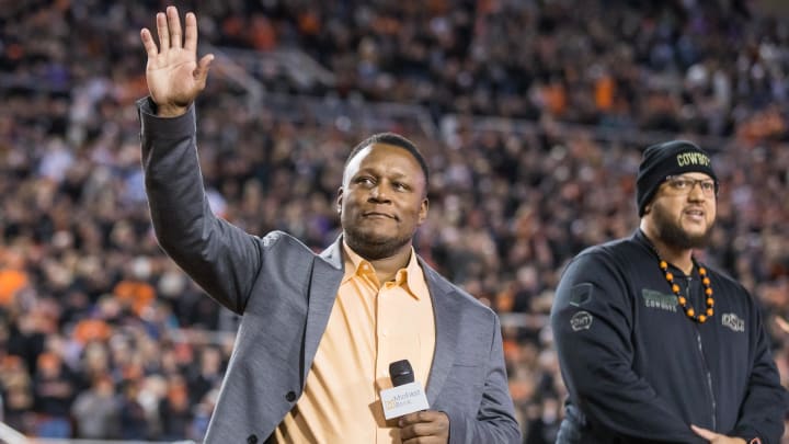 Nov 13, 2021; Stillwater, Oklahoma, USA;  Barry Sanders acknowledges the Oklahoma State Cowboys crowd before the game against the TCU Horned Frogs at Boone Pickens Stadium. OSU won 63-17. Mandatory Credit: Brett Rojo-USA TODAY Sports