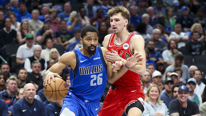 Nov 6, 2024; Dallas, Texas, USA;  Dallas Mavericks guard Spencer Dinwiddie (26) drives to the basket as Chicago Bulls forward Matas Buzelis (14) defends during the second half at American Airlines Center. Mandatory Credit: Kevin Jairaj-Imagn Images