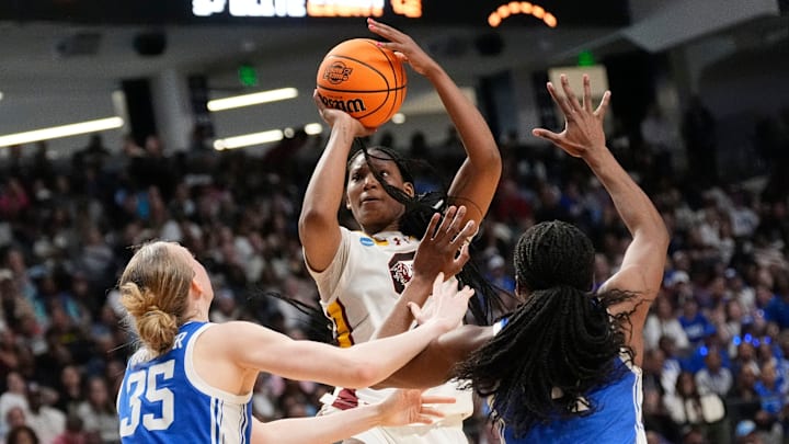 Mar 30, 2025; Birmingham, AL, USA; South Carolina Gamecocks forward Sania Feagin (20) shoots between Duke Blue Devils forward Toby Fournier (35) and Duke Blue Devils forward Jadyn Donovan (4) at Legacy Arena. South Carolina defeated Duke 54-50 to advance to the Final Four. Mandatory Credit: Gary Cosby Jr.-Tuscaloosa News