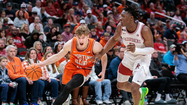 Nov 28, 2024; Kansas City, Missouri, USA; Illinois Fighting Illini guard Kasparas Jakucionis (32) drives around Arkansas Razorbacks forward Adou Thiero (3) during the second half at T-Mobile Center. Mandatory Credit: William Purnell-Imagn Images Nov 28, 2024; Kansas City, Missouri, USA; Illinois Fighting Illini guard Kasparas Jakucionis (32) drives around Arkansas Razorbacks forward Adou Thiero (3) during the second half at T-Mobile Center. Mandatory Credit: William Purnell-Imagn Images