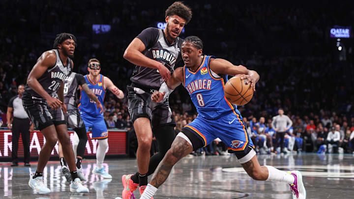 Feb 26, 2025; Brooklyn, New York, USA;  Oklahoma City Thunder forward Jalen Williams (8) looks to drive past Brooklyn Nets forward Cameron Johnson (2) in the first quarter at Barclays Center. Mandatory Credit: Wendell Cruz-Imagn Images