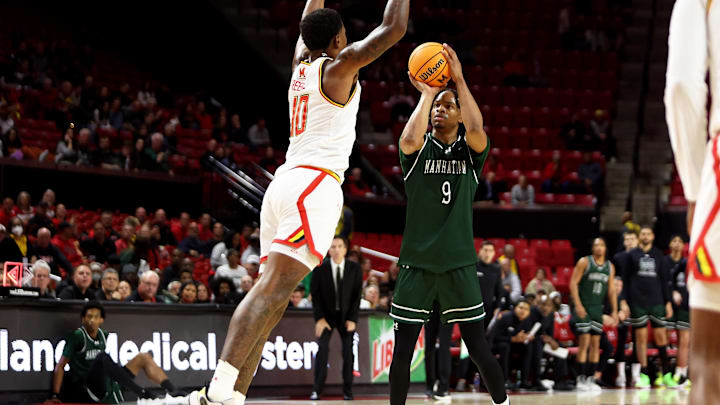  Nov 4, 2024; College Park, Maryland, USA; Manhattan Jaspers forward Will Sydnor (9) takes a shot over Maryland Terrapins forward Julian Reese (10) at Xfinity Center. Mandatory Credit: Daniel Kucin Jr.-Imagn Images