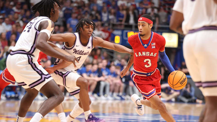 Kansas redshirt senior guard Dajuan Harris Jr. (3) drives the ball against Kansas State in the first