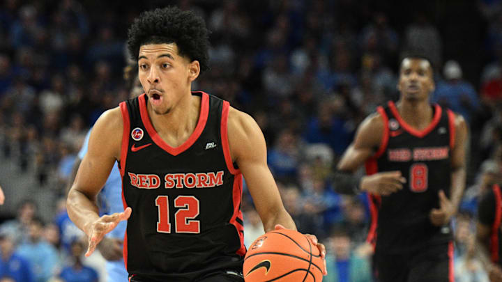 Dec 31, 2024; Omaha, Nebraska, USA;  St. John's basketball guard RJ Luis Jr. (12) dribbles against the Creighton Bluejays during the first half at CHI Health Center Omaha. 