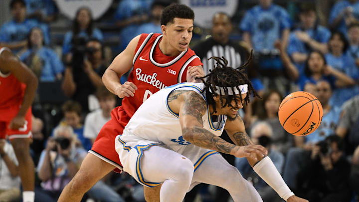 Feb 23, 2025; Los Angeles, California, USA; UCLA Bruins guard Skyy Clark (55) and Ohio State Buckeyes guard John Mobley Jr. (0) chase down a loose ball during the first half at Pauley Pavilion presented by Wescom. Mandatory Credit: Robert Hanashiro-Imagn Images Feb 23, 2025; Los Angeles, California, USA; UCLA Bruins guard Skyy Clark (55) and Ohio State Buckeyes guard John Mobley Jr. (0) chase down a loose ball during the first half at Pauley Pavilion presented by Wescom. Mandatory Credit: Robert Hanashiro-Imagn Images