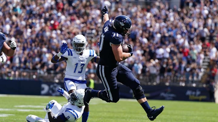 Connecticut Huskies offensive lineman Valentin Senn runs the ball against Central Connecticut State.. Connecticut Huskies offensive lineman Valentin Senn runs the ball against Central Connecticut State..