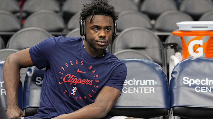 Jan 31, 2025; Charlotte, North Carolina, USA; LA Clippers guard Kobe Brown (21) takes a break during pregame warm ups against the Charlotte Hornets at Spectrum Center. Mandatory Credit: Jim Dedmon-Imagn Images