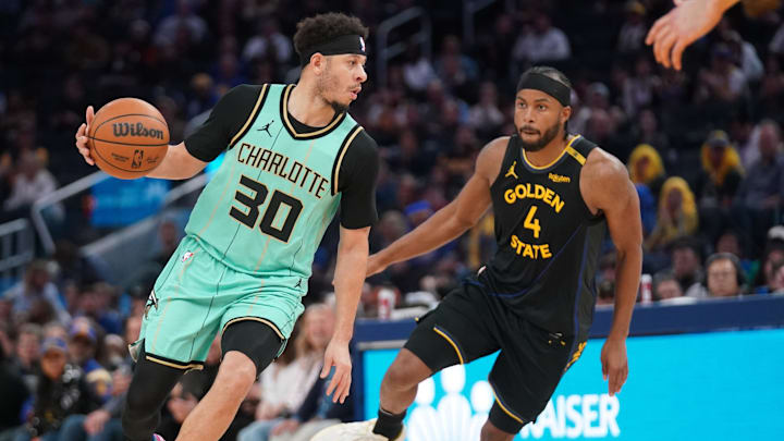 Charlotte Hornets guard Seth Curry dribbles against Golden State Warriors guard Moses Moody in the fourth quarter at the Chase Center. Charlotte Hornets guard Seth Curry dribbles against Golden State Warriors guard Moses Moody in the fourth quarter at the Chase Center.