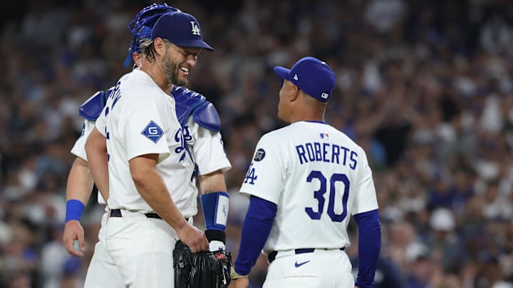 Sep 19, 2025; Los Angeles, California, USA; Los Angeles Dodgers pitcher Clayton Kershaw (22) greets manager Dave Roberts (30) as he is relieved during the fifth inning against the San Francisco Giants at Dodger Stadium. Mandatory Credit: Kiyoshi Mio-Imagn Images