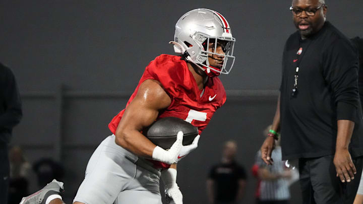 Mar 7, 2024; Columbus, OH, USA; Ohio State Buckeyes running back Dallan Hayden (5) runs during spring football practice at the Woody Hayes Athletic Center.