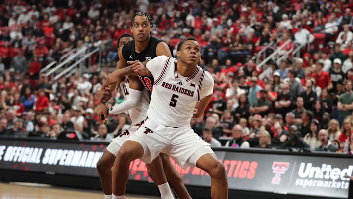 Feb 24, 2026; Lubbock, Texas, USA; Texas Tech Red Raiders forward Josiah Moseley (5) boxes out Cincinnati Bearcats forward Baba Miller (18) in the second half at United Supermarkets Arena. Mandatory Credit: Michael C. Johnson-Imagn Images Feb 24, 2026; Lubbock, Texas, USA; Texas Tech Red Raiders forward Josiah Moseley (5) boxes out Cincinnati Bearcats forward Baba Miller (18) in the second half at United Supermarkets Arena. Mandatory Credit: Michael C. Johnson-Imagn Images