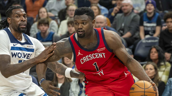Mar 19, 2025; Minneapolis, Minnesota, USA; New Orleans Pelicans forward Zion Williamson (1) drives to the basket past Minnesota Timberwolves center Naz Reid (11) in the second half at Target Center. Mandatory Credit: Jesse Johnson-Imagn Images