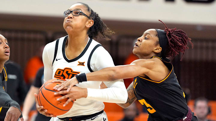 Oklahoma State Cowgirls guard Stailee Heard (32) goes past Arizona State Sun Devils guard Tyi Skinner (3) during a women's college basketball game between the Oklahoma State Cowgirls (OSU) and the Arizona State Sun Devils at Gallagher-Iba Arena in Stillwater, Okla., Wednesday, Jan. 29, 2025.