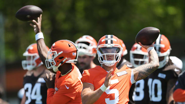 May 10, 2025; Berea, OH, USA; Cleveland Browns quarterback Dillon Gabriel (5) and quarterback Shedeur Sanders (12) throw passes during rookie minicamp at CrossCountry Mortgage Campus. 
