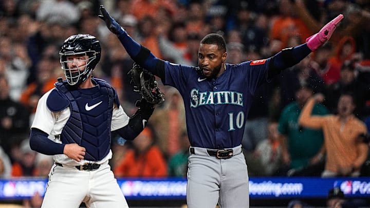 Seattle Mariners right fielder Victor Robles (10) slides into home to score a run against Detroit Tigers catcher Dillon Dingler (13) during the third inning of ALDS Game 3 at Comerica Park in Detroit on Tuesday, Oct. 7, 2025.