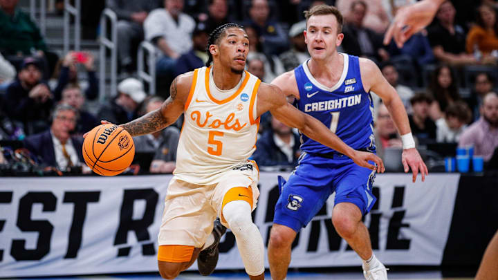 Tennessee guard Zakai Zeigler (5) dribbles against Creighton guard Steven Ashworth (1) during the