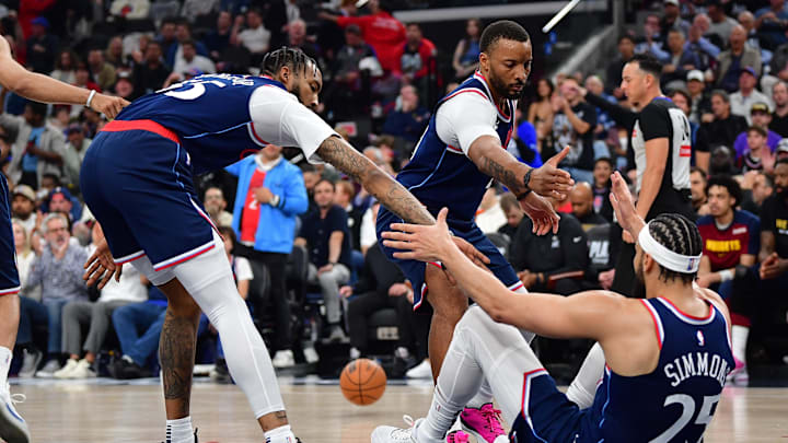 Apr 24, 2025; Inglewood, California, USA; Los Angeles Clippers guard Ben Simmons (25) is helped up by forward Derrick Jones Jr. (55) and guard Norman Powell (24) after being fouled during the first half of game three in the first round for the 2024 NBA Playoffs at Intuit Dome. Mandatory Credit: Gary A. Vasquez-Imagn Images Apr 24, 2025; Inglewood, California, USA; Los Angeles Clippers guard Ben Simmons (25) is helped up by forward Derrick Jones Jr. (55) and guard Norman Powell (24) after being fouled during the first half of game three in the first round for the 2024 NBA Playoffs at Intuit Dome. Mandatory Credit: Gary A. Vasquez-Imagn Images