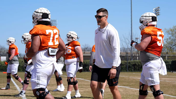 Oklahoma State offensive lineman coach Cooper Bassett runs drills during a Spring football practice at Oklahoma State University in Stillwater, Okla., Tuesday, April, 8, 2025. Oklahoma State offensive lineman coach Cooper Bassett runs drills during a Spring football practice at Oklahoma State University in Stillwater, Okla., Tuesday, April, 8, 2025.