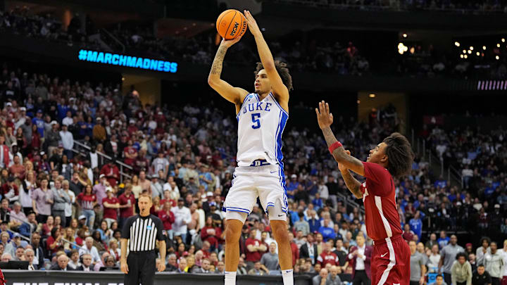 Mar 29, 2025; Newark, NJ, USA; Duke Blue Devils guard Tyrese Proctor (5) shoots the ball against Alabama Crimson Tide guard Labaron Philon (0) during the second half in the East Regional final of the 2025 NCAA tournament at Prudential Center. Mandatory Credit: Robert Deutsch-Imagn Images