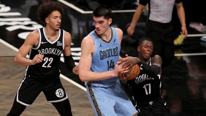 Nov 4, 2024; Brooklyn, New York, USA; Brooklyn Nets guard Dennis Schroder (17) steals the ball from Memphis Grizzlies center Zach Edey (14) in front of Nets forward Jalen Wilson (22) during the third quarter at Barclays Center. Mandatory Credit: Brad Penner-Imagn Images Nov 4, 2024; Brooklyn, New York, USA; Brooklyn Nets guard Dennis Schroder (17) steals the ball from Memphis Grizzlies center Zach Edey (14) in front of Nets forward Jalen Wilson (22) during the third quarter at Barclays Center. Mandatory Credit: Brad Penner-Imagn Images