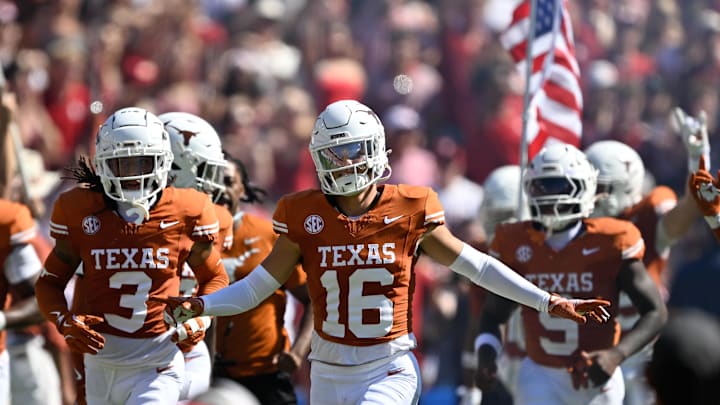 Oct 11, 2025; Dallas, Texas, USA; Texas Longhorns defensive back Michael Taaffe (16) leads the team on to the field against the Oklahoma Sooners at the Cotton Bowl. Mandatory Credit: Jerome Miron-Imagn Images