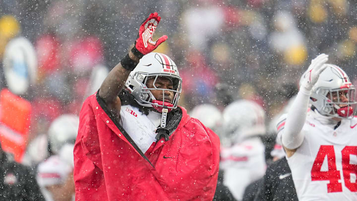 Ohio State Buckeyes wide receiver Jeremiah Smith (4) waves as Michigan Wolverines fans stream out of the gates in the fourth quarter of the NCAA football game at Michigan Stadium in Ann Arbor, Mich. on Nov. 29, 2025. Ohio State won 27-9. Ohio State Buckeyes wide receiver Jeremiah Smith (4) waves as Michigan Wolverines fans stream out of the gates in the fourth quarter of the NCAA football game at Michigan Stadium in Ann Arbor, Mich. on Nov. 29, 2025. Ohio State won 27-9.