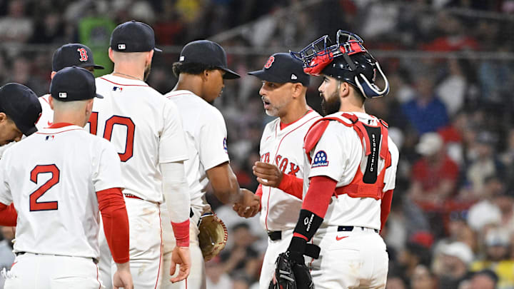 May 2, 2025; Boston, Massachusetts, USA; Boston Red Sox manager Alex Cora (13) (2nd from right) relieves starting pitcher Brayan Bello (66) of pitching duties during the seventh inning against the Minnesota Twins at Fenway Park. Mandatory Credit: Eric Canha-Imagn Images