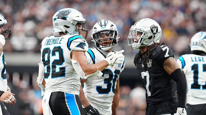 Sep 22, 2024; Paradise, Nevada, USA; Las Vegas Raiders safety Tre'von Moehrig (7) has words with Carolina Panthers tight end Tommy Tremble (82) and Las Vegas Raiders cornerback Darnay Holmes (30) during the fourth quarter at Allegiant Stadium. Mandatory Credit: Stephen R. Sylvanie-Imagn Images