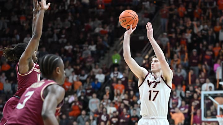 Feb 14, 2026; Blacksburg, Virginia, USA; Virginia Tech Hokies guard Neoklis Avdalas (17) shoots shoots as Florida State Seminoles guard Xavier Osceola (11) defends during the second half at Cassell Coliseum. Mandatory Credit: Brian Bishop-Imagn Images Feb 14, 2026; Blacksburg, Virginia, USA; Virginia Tech Hokies guard Neoklis Avdalas (17) shoots shoots as Florida State Seminoles guard Xavier Osceola (11) defends during the second half at Cassell Coliseum. Mandatory Credit: Brian Bishop-Imagn Images