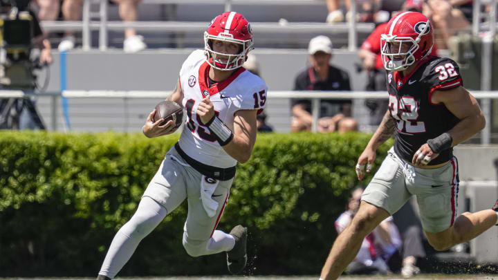 Apr 13, 2024; Athens, GA, USA; Georgia Bulldogs quarterback Carson Beck (15) runs past linebacker Chaz Chambliss (32) during the G-Day Game at Sanford Stadium. Mandatory Credit: Dale Zanine-USA TODAY Sports