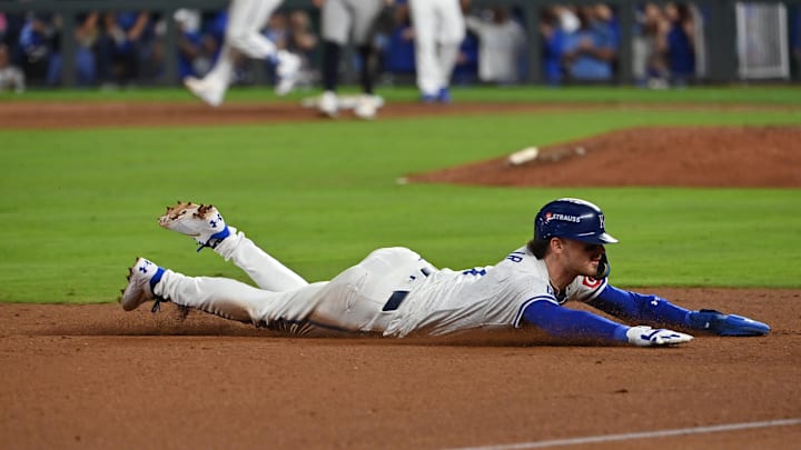 Kansas City Royals shortstop Bobby Witt Jr. (7) dices to third base in the eighth inning against the New York Yankees during game three of the NLDS for the 2024 MLB Playoffs at Kauffman Stadium. 