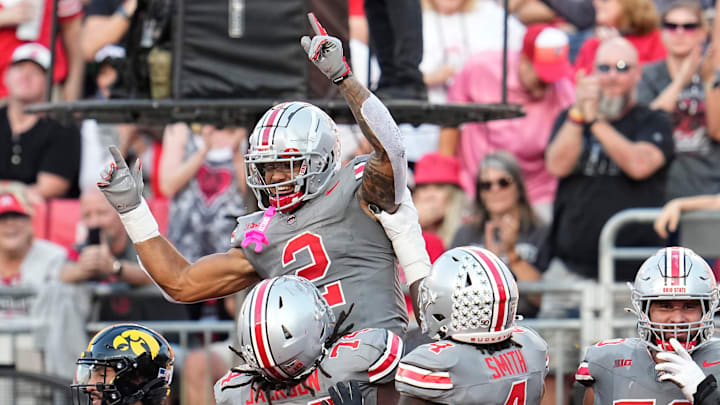 Oct 5, 2024; Columbus, OH, USA; Ohio State Buckeyes wide receiver Emeka Egbuka (2) celebrates a touchdown during the second half of the NCAA football game against the Iowa Hawkeyes at Ohio Stadium. Ohio State won 35-7.